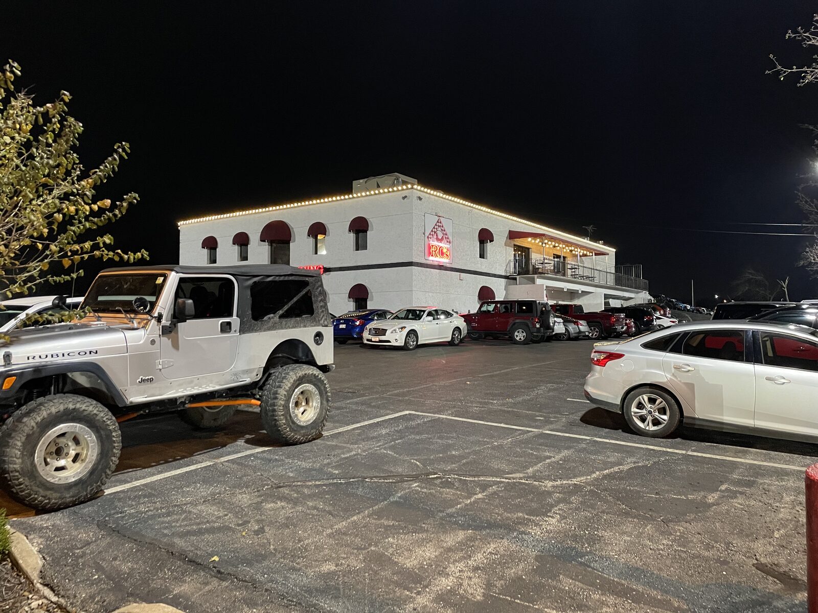 Residential roofline Christmas lights — professional installation at night