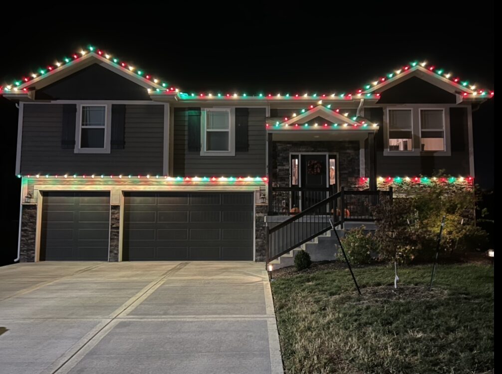 Red, green, and warm white C9 lights on split-level home — Reign Enterprises